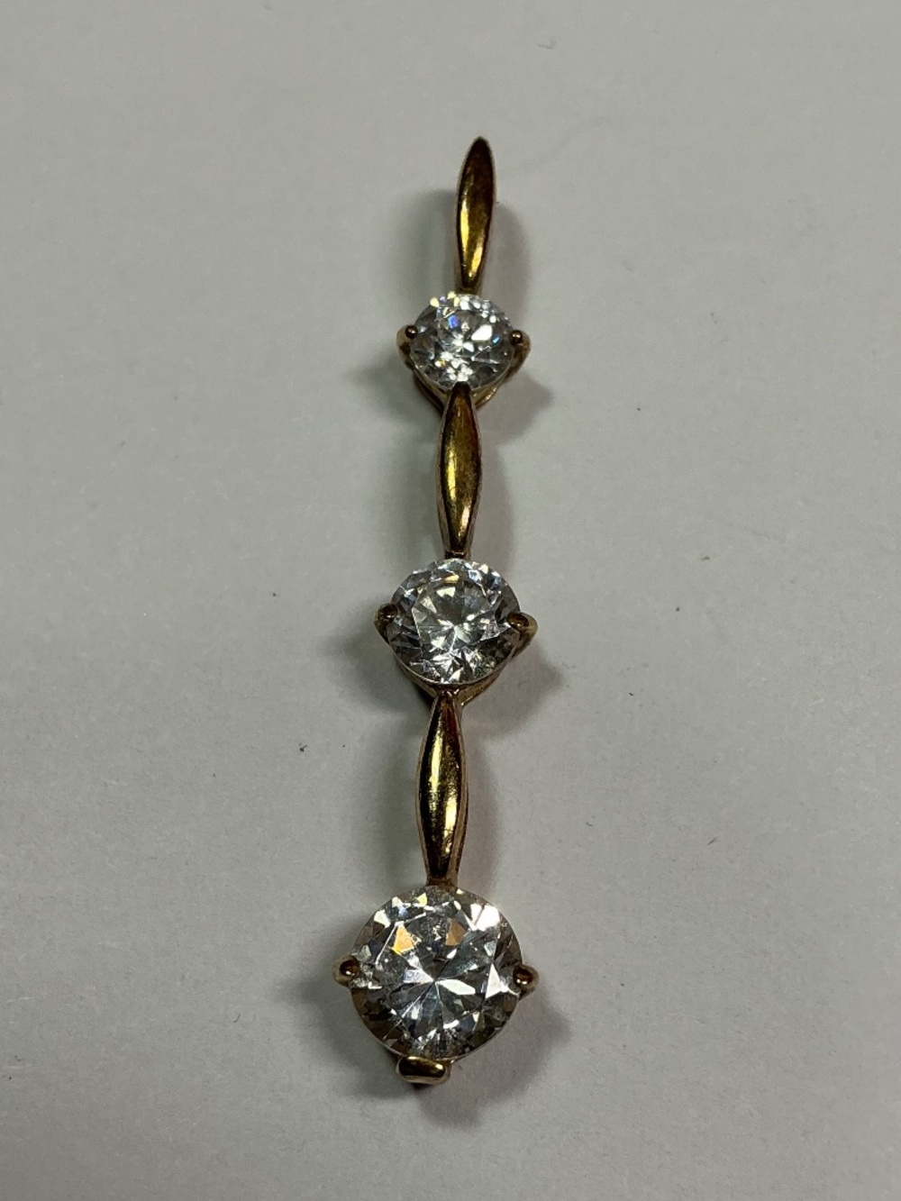 Sterling Silver Gold Plated Vertical Pendant with clear stones. 1.5 inches long